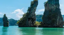 Stunning limestone cliffs rise above crystal-clear turquoise waters in Phuket.