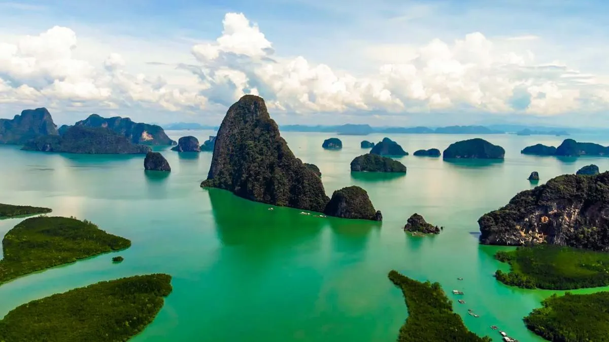 Scenic view of Phang Nga Bay in Phuket with lush islands and turquoise waters.