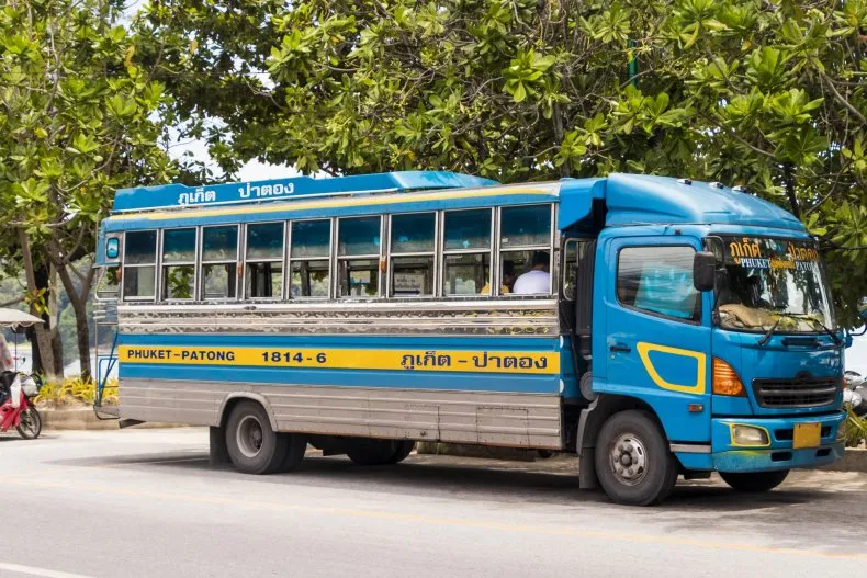 Blue and silver bus labeled 