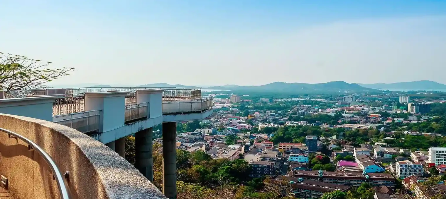 Scenic view of Phuket from a viewpoint with city and mountains in the distance.