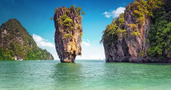 Stunning rock formations surrounded by turquoise water in Phuket, Thailand.