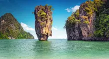 Stunning rock formations surrounded by turquoise water in Phuket, Thailand.