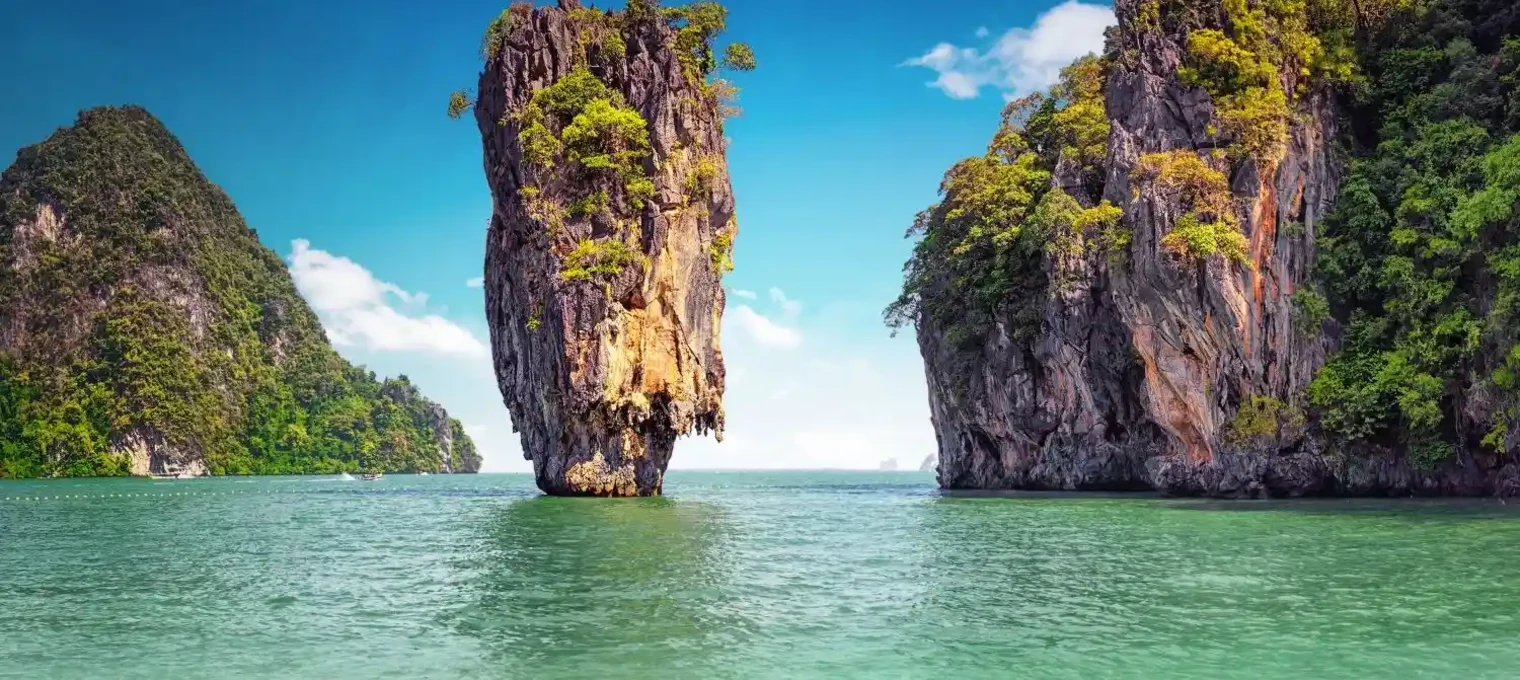 Stunning rock formations surrounded by turquoise water in Phuket, Thailand.