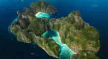 Aerial view of lush islands with turquoise waters in Phuket, Thailand.