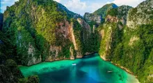 Stunning aerial view of Phukett's lush mountains and turquoise waters. Perfect tropical scenery.