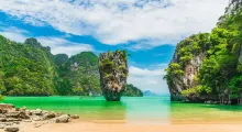 Breathtaking view of limestone cliffs and turquoise waters in Phuket, Thailand.