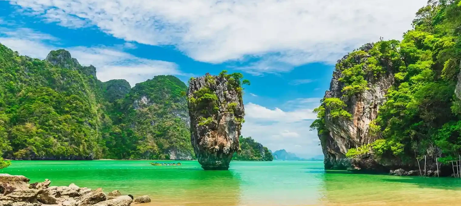 Breathtaking view of limestone cliffs and turquoise waters in Phuket, Thailand.